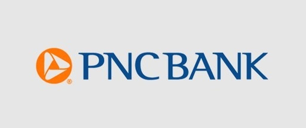PNC Bank corporate logo featuring an orange circle with a stylized white triangle to the left of the blue “PNC BANK” wordmark centered on a light gray background.